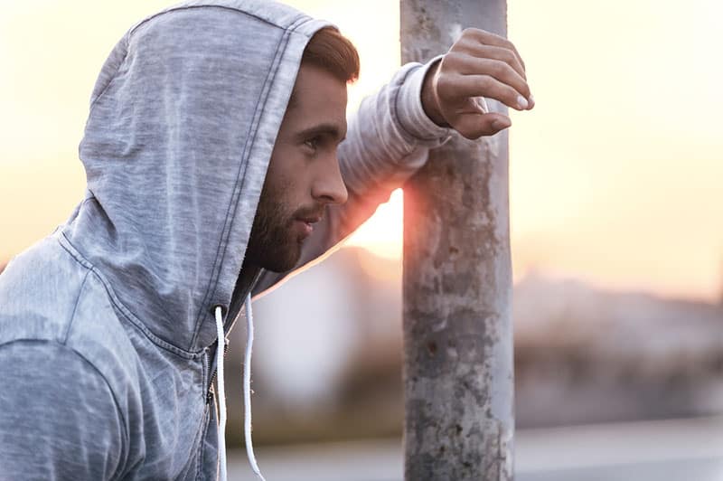 Man with a hoodie at a distance