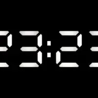 Digitaluhr auf 23:23 Uhr auf schwarzem Hintergrund