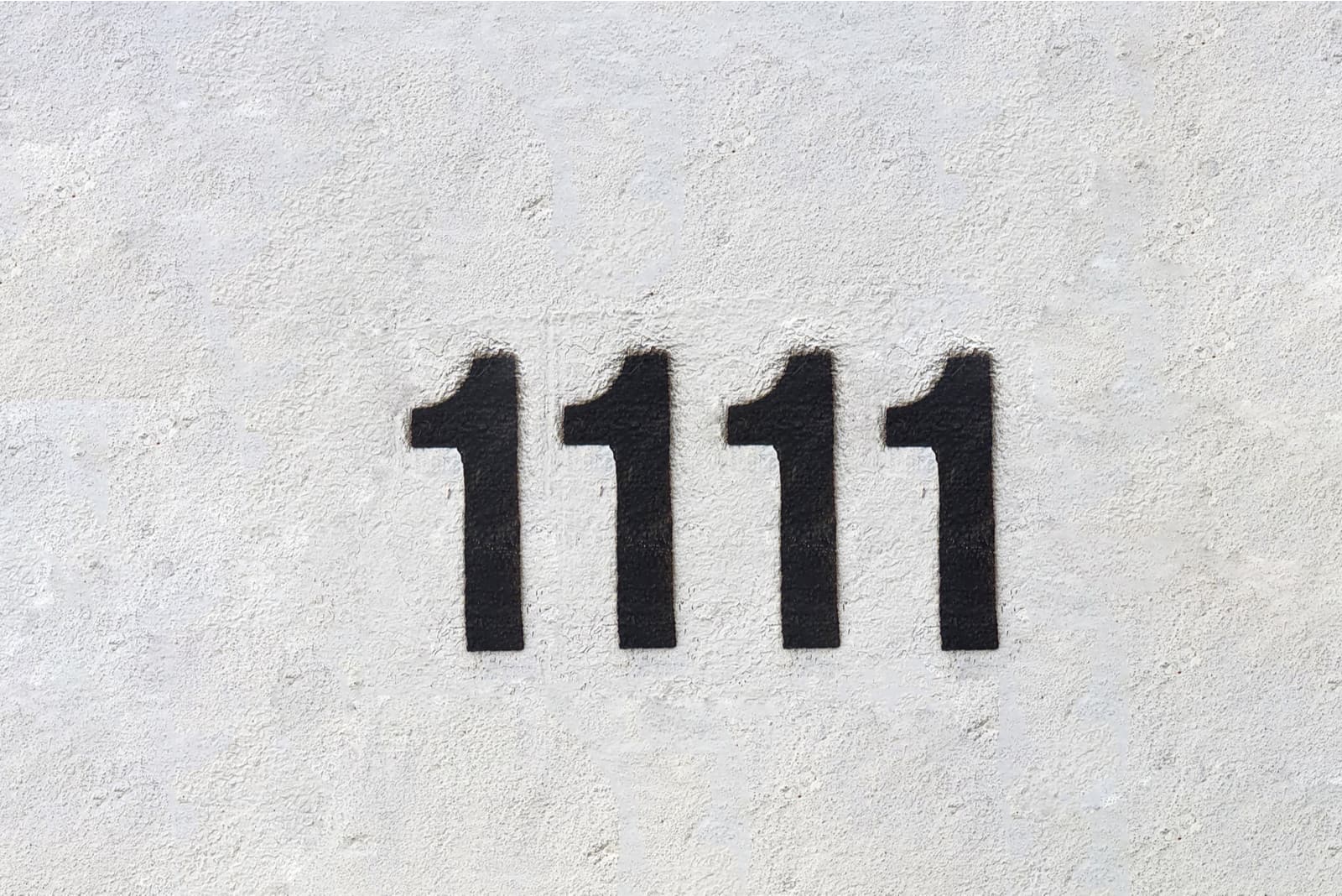 Zahlen 1111 auf grauem Hintergrund