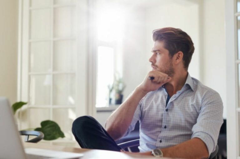 handsome man sitting and looking at distance